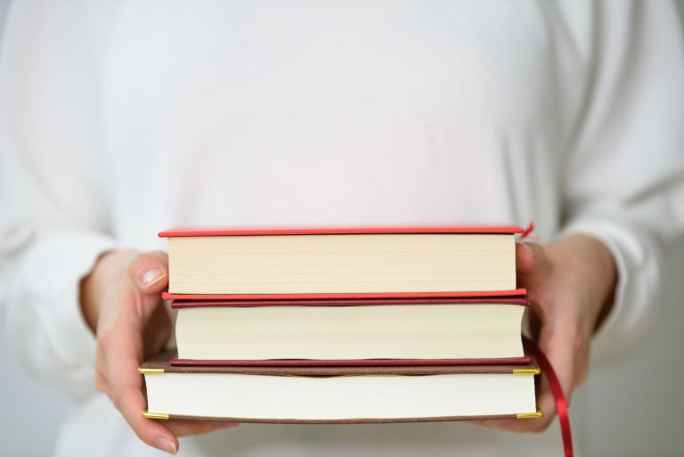 a-woman-holding-a-book-for-reading